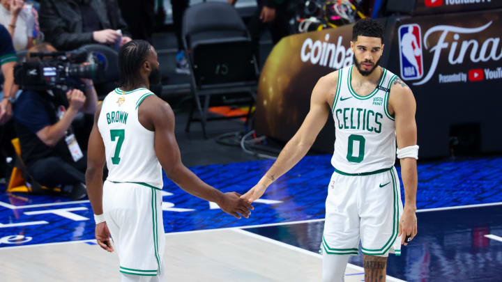 Jun 14, 2024; Dallas, Texas, USA; Boston Celtics forward Jayson Tatum (0) and Boston Celtics guard Jaylen Brown (7) react during the game during game four of the 2024 NBA Finals at American Airlines Center. Mandatory Credit: Kevin Jairaj-USA TODAY Sports