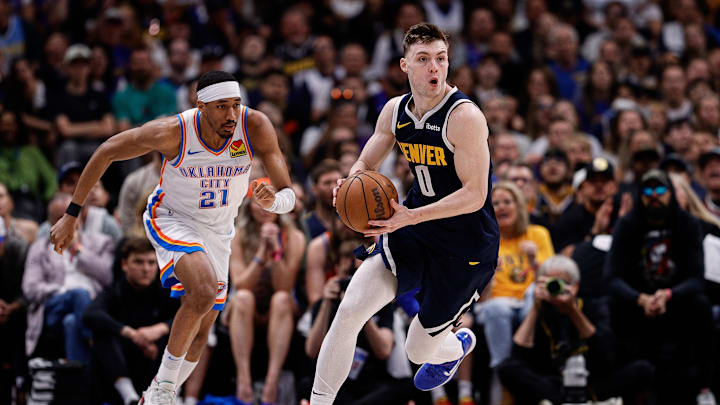 May 11, 2025; Denver, Colorado, USA; Denver Nuggets guard Christian Braun (0) controls the ball ahead of Oklahoma City Thunder guard Aaron Wiggins (21) in the third quarter during game four of the second round of the 2025 NBA Playoffs at Ball Arena. Mandatory Credit: Isaiah J. Downing-Imagn Images May 11, 2025; Denver, Colorado, USA; Denver Nuggets guard Christian Braun (0) controls the ball ahead of Oklahoma City Thunder guard Aaron Wiggins (21) in the third quarter during game four of the second round of the 2025 NBA Playoffs at Ball Arena. Mandatory Credit: Isaiah J. Downing-Imagn Images