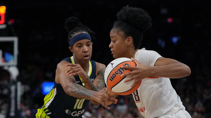 Jul 7, 2025; Phoenix, Arizona, USA; Phoenix Mercury guard Monique Akoa Makani (8) drives against Dallas Wings guard Aziaha James (10) in the second half at Footprint Center. Mandatory Credit: Rick Scuteri-Imagn Images
