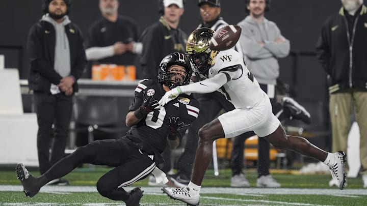 Jan 2, 2026; Charlotte, NC, USA; Mississippi State Bulldogs wide receiver Brenen Thompson (0) makes a opening play catch defended by Wake Forest Demon Deacons defensive back Karon Prunty (3) during the first quarter at Bank of America Stadium. Mandatory Credit: Jim Dedmon-Imagn Images Jan 2, 2026; Charlotte, NC, USA; Mississippi State Bulldogs wide receiver Brenen Thompson (0) makes a opening play catch defended by Wake Forest Demon Deacons defensive back Karon Prunty (3) during the first quarter at Bank of America Stadium. Mandatory Credit: Jim Dedmon-Imagn Images