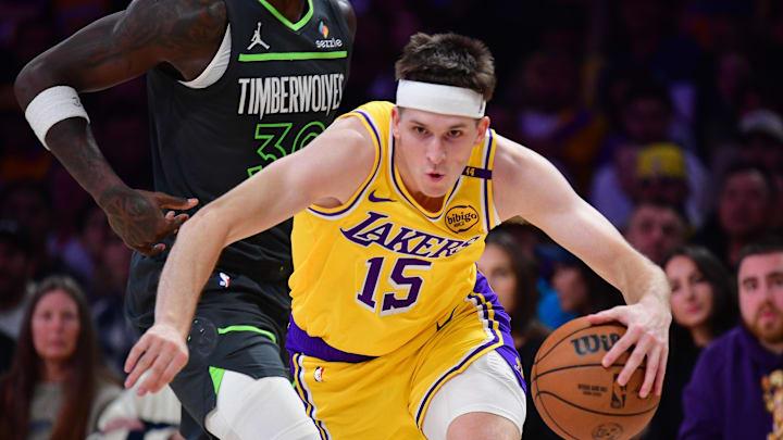Apr 30, 2025; Los Angeles, California, USA; Los Angeles Lakers guard Austin Reaves (15) moves the ball ahead of Minnesota Timberwolves forward Julius Randle (30) during the first half in game five of first round for the 2025 NBA Playoffs at Crypto.com Arena. Mandatory Credit: Gary A. Vasquez-Imagn Images Apr 30, 2025; Los Angeles, California, USA; Los Angeles Lakers guard Austin Reaves (15) moves the ball ahead of Minnesota Timberwolves forward Julius Randle (30) during the first half in game five of first round for the 2025 NBA Playoffs at Crypto.com Arena. Mandatory Credit: Gary A. Vasquez-Imagn Images