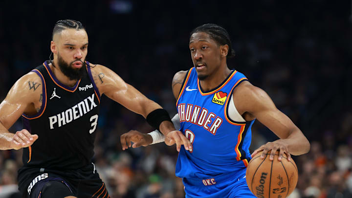 Jan 4, 2026; Phoenix, Arizona, USA; Phoenix Suns forward Dillon Brooks (3) defends against Oklahoma City Thunder guard Jalen Williams (8) at Mortgage Matchup Center. Mandatory Credit: Mark J. Rebilas-Imagn Images