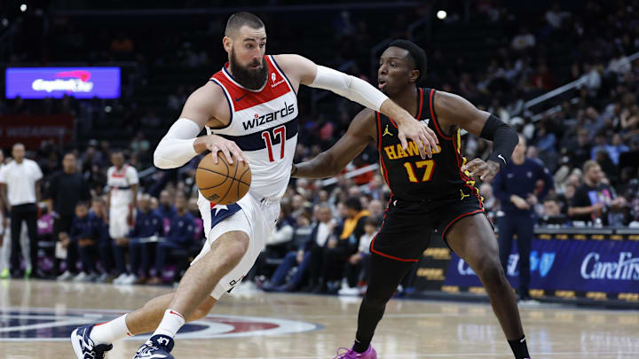 Oct 30, 2024; Washington, District of Columbia, USA; Washington Wizards center Jonas Valanciunas (17) drives to the basket as Atlanta Hawks forward Onyeka Okongwu (17) defends in the second half at Capital One Arena. Mandatory Credit: Geoff Burke-Imagn Images