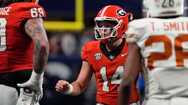 Georgia quarterback Gunner Stockton (14) gets set to run a play during the second half of the SEC championship game against Texas in Atlanta, on Saturday, Dec. 7, 2024. Georgia quarterback Gunner Stockton (14) gets set to run a play during the second half of the SEC championship game against Texas in Atlanta, on Saturday, Dec. 7, 2024.