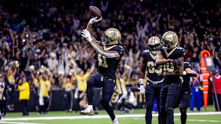 Dec 1, 2024; New Orleans, Louisiana, USA;  New Orleans Saints running back Alvin Kamara (41) runs in for a touchdown against the Los Angeles Rams but it is called back for man downfield during the first half at Caesars Superdome. Mandatory Credit: Stephen Lew-Imagn Images