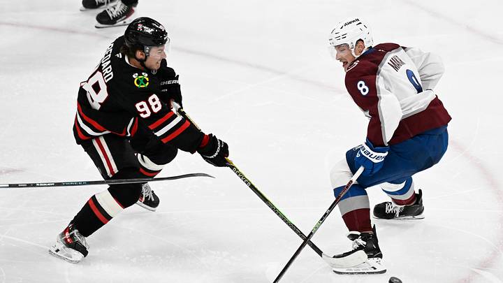 Mar 20, 2026; Chicago, Illinois, USA;  Chicago Blackhawks center Connor Bedard (98) moves the puck past Colorado Avalanche defenseman Cale Makar (8) during the second period at United Center. Mandatory Credit: Matt Marton-Imagn Images