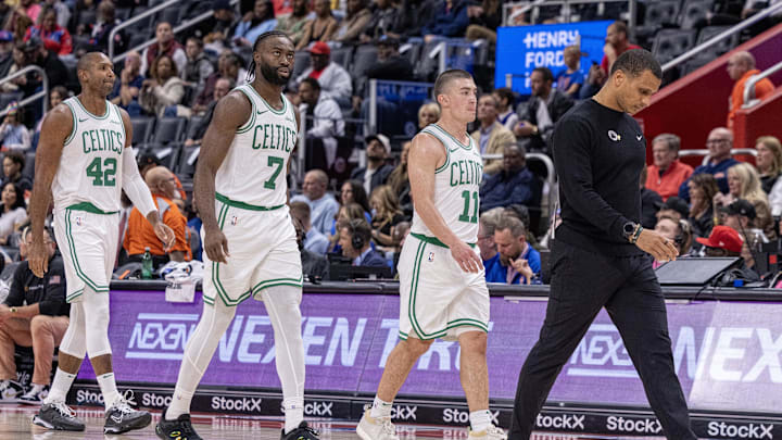 Oct 26, 2024; Detroit, Michigan, USA; Boston Celtics head coach Joe Mazzulla walks back to his bench in front of guard Payton Pritchard (11), guard Jaylen Brown (7) and center Al Horford (42) during the second half of the game against the Detroit Pistons at Little Caesars Arena. Mandatory Credit: David Reginek-Imagn Images