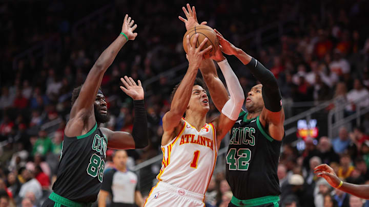 Nov 4, 2024; Atlanta, Georgia, USA; Atlanta Hawks forward Jalen Johnson (1) is defended by Boston Celtics center Neemias Queta (88) and center Al Horford (42) in the third quarter at State Farm Arena. Mandatory Credit: Brett Davis-Imagn Images
