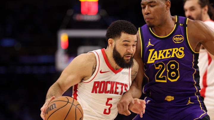 Mar 31, 2025; Los Angeles, California, USA;  Houston Rockets guard Fred VanVleet (5) drives to the basket against Los Angeles Lakers forward Rui Hachimura (28) during the third quarter at Crypto.com Arena. Mandatory Credit: Kiyoshi Mio-Imagn Images