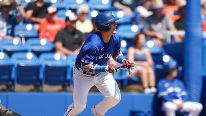 Toronto Blue Jays outfielder Daulton Varsho (5) hits an rbi single against the Baltimore Orioles in the first inning during spring training at TD Ballpark on March 13.