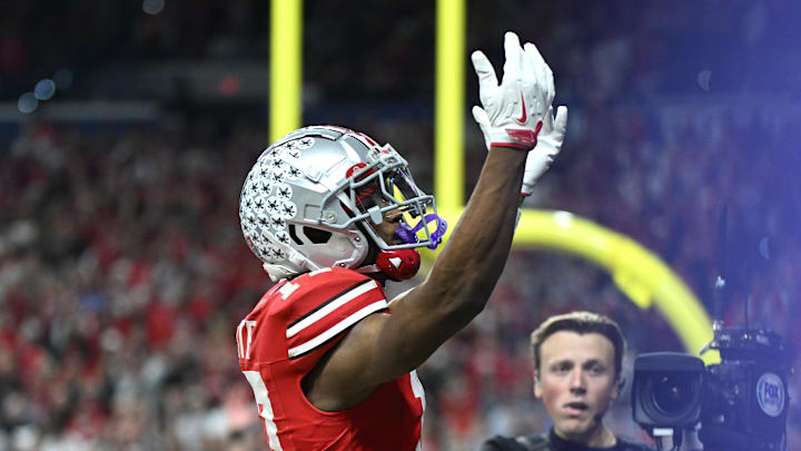 Dec 6, 2025; Indianapolis, IN, USA; Ohio State Buckeyes wide receiver Carnell Tate (17) celebrates after scoring a touchdown against the Indiana Hoosiers in the first quarter during the 2025 Big Ten championship game at Lucas Oil Stadium. Mandatory Credit: Robert Goddin-Imagn Images