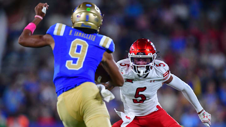 Aug 30, 2025; Pasadena, California, USA; Utah Utes safety Tao Johnson (5) moves in against UCLA Bruins quarterback Nico Iamaleava (9) during the first half at Rose Bowl. Mandatory Credit: Gary A. Vasquez-Imagn Images