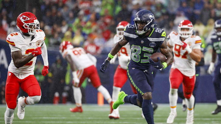Aug 15, 2025; Seattle, Washington, USA; Seattle Seahawks wide receiver Dareke Young (83) runs for yards after the catch against Kansas City Chiefs cornerback Joshua Williams (2) during the second quarter at Lumen Field. Mandatory Credit: Joe Nicholson-Imagn Images