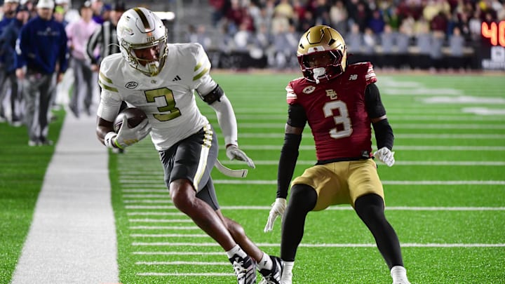 Nov 15, 2025; Chestnut Hill, Massachusetts, USA; Georgia Tech Yellow Jackets wide receiver Eric Rivers (3) runs with the ball while Boston College Eagles defensive back Max Tucker (3) defends during the second half at Alumni Stadium. Mandatory Credit: Bob DeChiara-Imagn Images