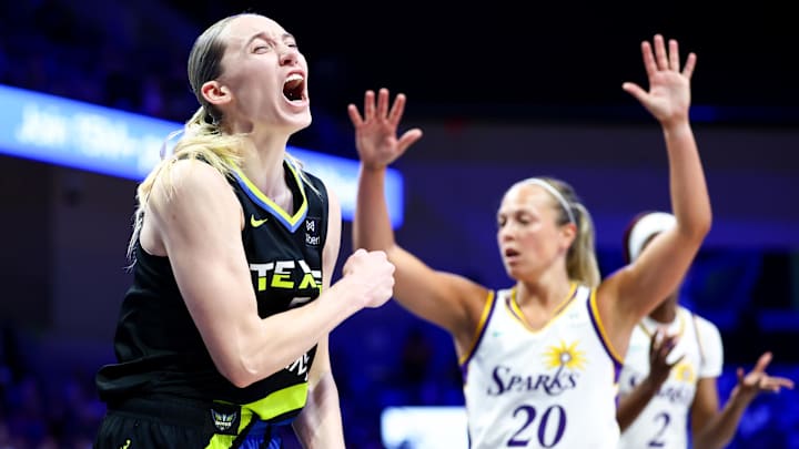 Aug 15, 2025; Arlington, Texas, USA;  Dallas Wings guard Paige Bueckers (5) reacts in front of Los Angeles Sparks guard Julie Allemand (20) during the second half at College Park Center. Mandatory Credit: Kevin Jairaj-Imagn Images