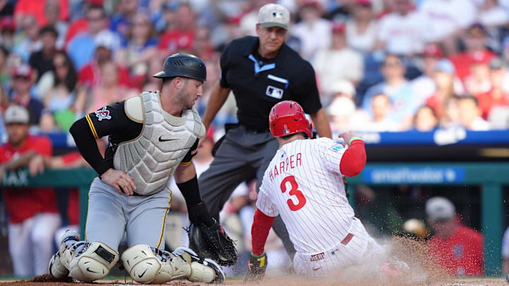 May 17, 2025; Philadelphia, Pennsylvania, USA; Pittsburgh Pirates catcher Joey Bart (14) tags Philadelphia Phillies infielder Bryce Harper (3) out at home in the first inning at Citizens Bank Park. Mandatory Credit: Kyle Ross-Imagn Images