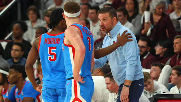 Jan 18, 2025; Starkville, Mississippi, USA; Mississippi Rebels head coach Chris Beard (right) talks with guard Jaylen Murray (5) and guard Sean Pedulla (3) during the second half against the Mississippi State Bulldogs at Humphrey Coliseum. Mandatory Credit: Petre Thomas-Imagn Images