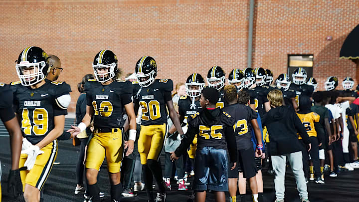 Oct 20, 2023; Carrollton, GA, USA; Carrollton Trojans quarterback Julian Lewis (10) enters the field against the Westlake Lions at Grisham Stadium. The 15-year-old Carrollton High student has already committed to playing for the University of Southern California Trojans and has been considered one of the top high school quarterback prospects. Mandatory Credit: John David Mercer-Imagn Images
