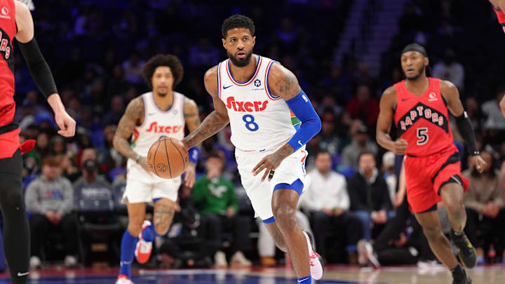 Feb 11, 2025; Philadelphia, Pennsylvania, USA; Philadelphia 76ers forward Paul George (8) drives with the ball against the Toronto Raptors in the first quarter at Wells Fargo Center. Mandatory Credit: Kyle Ross-Imagn Images