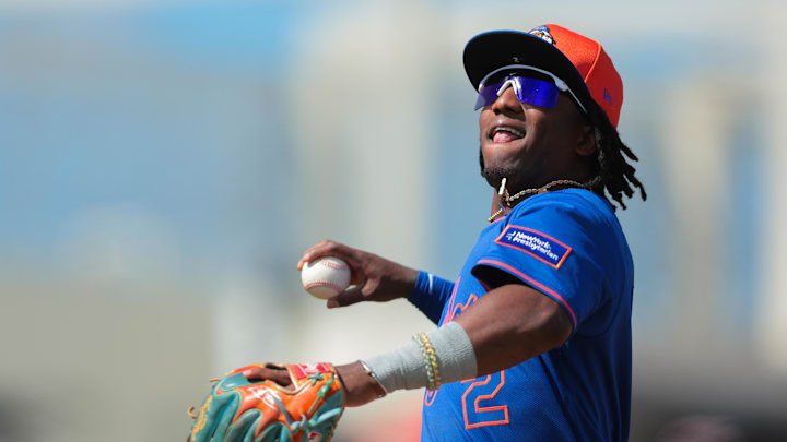 New York Mets shortstop Luisangel Acuna (2) throws a baseball into the stands after the second inning against the Houston Astros at CACTI Park of the Palm Beaches on Feb 25.