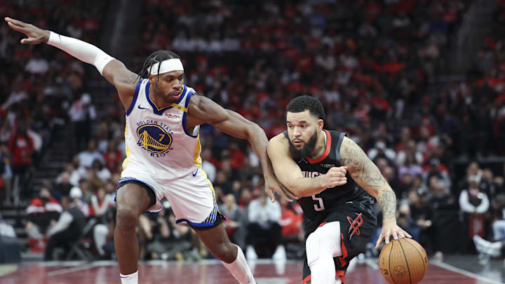 Dec 11, 2024; Houston, Texas, USA; Houston Rockets guard Fred VanVleet (5) controls the ball as Golden State Warriors guard Buddy Hield (7) defends during the fourth quarter at Toyota Center. Mandatory Credit: Troy Taormina-Imagn Images