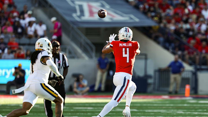 Oct 26, 2024; Tucson, Arizona, USA; Arizona Wildcats wide receiver Tetairoa McMillan (4) catches the ball during the first quarter against the West Virginia Mountaineers at Arizona Stadium. Mandatory Credit: Aryanna Frank-Imagn Images
