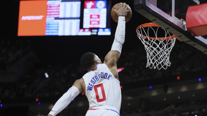 Feb 4, 2024; Miami, Florida, USA; LA Clippers guard Russell Westbrook (0) attempts to dunk the basketball against the Miami Heat during the fourth quarter at Kaseya Center. Mandatory Credit: Sam Navarro-USA TODAY Sports