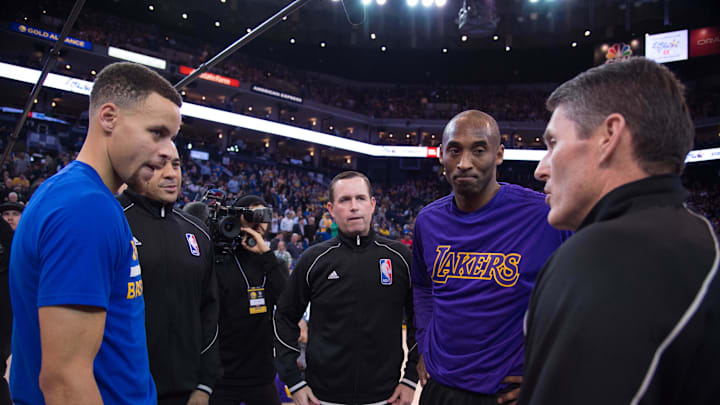 January 14, 2016; Oakland, CA, USA; (L-R) Golden State Warriors guard Stephen Curry (30), NBA referee Curtis Blair (74), NBA referee Matt Boland (18), and Los Angeles Lakers forward Kobe Bryant (24) listen to NBA referee Scott Foster (48) before the game at Oracle Arena. The Warriors defeated the Lakers 116-98. Mandatory Credit: Kyle Terada-Imagn Images January 14, 2016; Oakland, CA, USA; (L-R) Golden State Warriors guard Stephen Curry (30), NBA referee Curtis Blair (74), NBA referee Matt Boland (18), and Los Angeles Lakers forward Kobe Bryant (24) listen to NBA referee Scott Foster (48) before the game at Oracle Arena. The Warriors defeated the Lakers 116-98. Mandatory Credit: Kyle Terada-Imagn Images