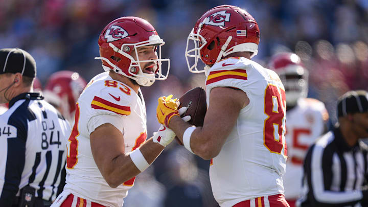 Nov 24, 2024; Charlotte, North Carolina, USA; Kansas City Chiefs tight end Noah Gray (83) and tight end Travis Kelce (87) celebrate his score against the Carolina Panthers during the first quarter at Bank of America Stadium. Mandatory Credit: Jim Dedmon-Imagn Images