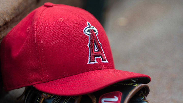 Jul 3, 2015; Arlington, TX, USA; A view of a Los Angeles Angels baseball hat and glove and logo before the game between the Texas Rangers and the Los Angeles Angels at Globe Life Park in Arlington. The Angels defeated the Rangers 8-2. Mandatory Credit: Jerome Miron-Imagn Images