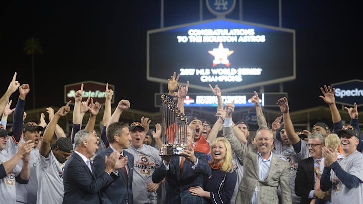 Nov 1, 2017; Los Angeles, CA, USA; Houston Astros owner Jim Crane and team celebrate after being presented with the Commissioner's Trophy after defeating the Los Angeles Dodgers in game seven of the 2017 World Series at Dodger Stadium. Mandatory Credit: Gary A. Vasquez-Imagn Images