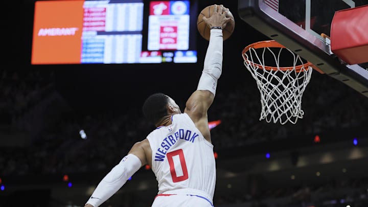 Russell Westbrook (0) dunks the basketball against the Miami Heat during the fourth quarter at Kaseya Center. 