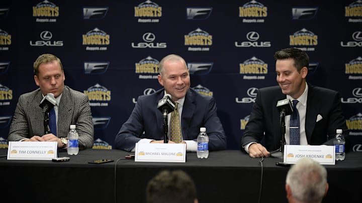 Jun 16, 2015; Denver, CO, USA; Denver Nuggets head coach Michael Malone (center) and general manager GM Tim Connelly (left) and president Josh Kroenke (right) during a press conference at the Pepsi Center. Mandatory Credit: Ron Chenoy-Imagn Images
