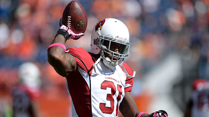 Oct 5, 2014; Denver, CO, USA; Arizona Cardinals cornerback Antonio Cromartie (31) before the game against the Denver Broncos at Sports Authority Field at Mile High. Mandatory Credit: Ron Chenoy-Imagn Images