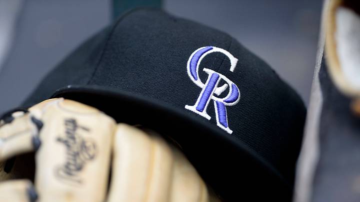 General view of a Colorado Rockies cap and glove General view of a Colorado Rockies cap and glove