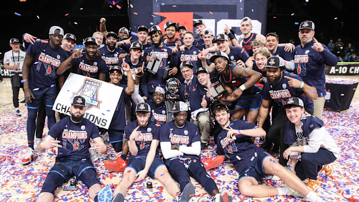 Duquesne celebrates their A-10 Championship victory over VCU