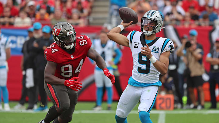 Dec 29, 2024; Tampa, Florida, USA; Carolina Panthers quarterback Bryce Young (9) throws the ball as Tampa Bay Buccaneers defensive tackle Calijah Kancey (94) rushes during the second quarter at Raymond James Stadium. Mandatory Credit: Kim Klement Neitzel-Imagn Images Dec 29, 2024; Tampa, Florida, USA; Carolina Panthers quarterback Bryce Young (9) throws the ball as Tampa Bay Buccaneers defensive tackle Calijah Kancey (94) rushes during the second quarter at Raymond James Stadium. Mandatory Credit: Kim Klement Neitzel-Imagn Images