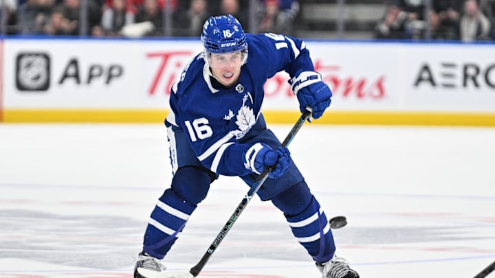 Apr 11, 2024; Toronto, Ontario, CAN; Toronto Maple Leafs forward Mitchell Marner (16) plays the puck against the New Jersey Devils in the third period at Scotiabank Arena. Mandatory Credit: Dan Hamilton-Imagn Images