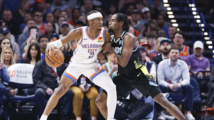 Mar 12, 2024; Oklahoma City, Oklahoma, USA; Indiana Pacers forward Aaron Nesmith (23) defends a drive by Oklahoma City Thunder guard Shai Gilgeous-Alexander (2) during the second half at Paycom Center. Mandatory Credit: Alonzo Adams-Imagn Images Mar 12, 2024; Oklahoma City, Oklahoma, USA; Indiana Pacers forward Aaron Nesmith (23) defends a drive by Oklahoma City Thunder guard Shai Gilgeous-Alexander (2) during the second half at Paycom Center. Mandatory Credit: Alonzo Adams-Imagn Images