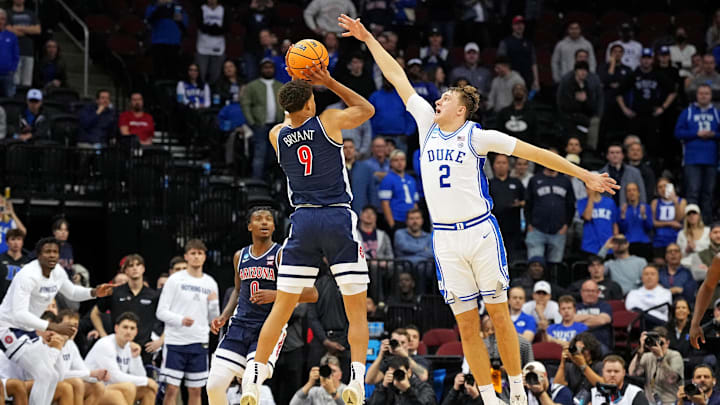 Mar 27, 2025; Newark, NJ, USA; Arizona Wildcats forward Carter Bryant (9) shoots the ball against Duke Blue Devils forward Cooper Flagg (2) during the second half during an East Regional semifinal of the 2025 NCAA tournament at Prudential Center. Mandatory Credit: Robert Deutsch-Imagn Images