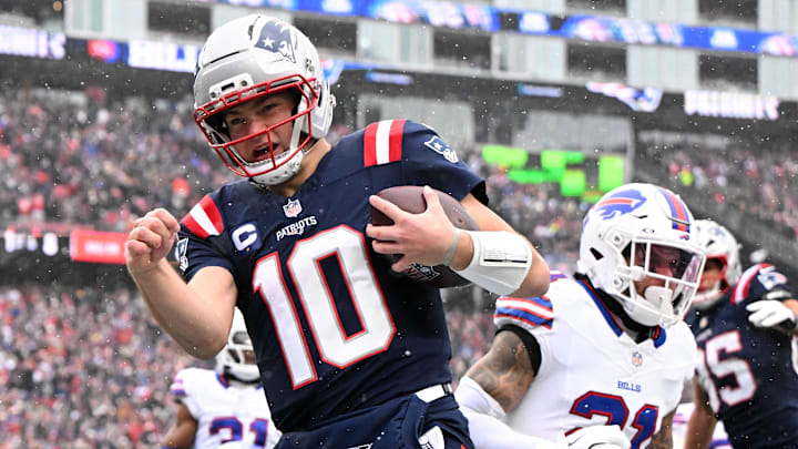 Dec 14, 2025; Foxborough, Massachusetts, USA; New England Patriots quarterback Drake Maye (10) runs for a touchdown against the Buffalo Bills during the first half at Gillette Stadium. Mandatory Credit: Brian Fluharty-Imagn Images