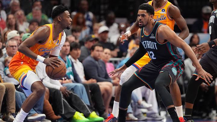 Charlotte Hornets forward Grant Williams (2) controls the ball against Detroit Pistons forward Tobias Harris Charlotte Hornets forward Grant Williams (2) controls the ball against Detroit Pistons forward Tobias Harris