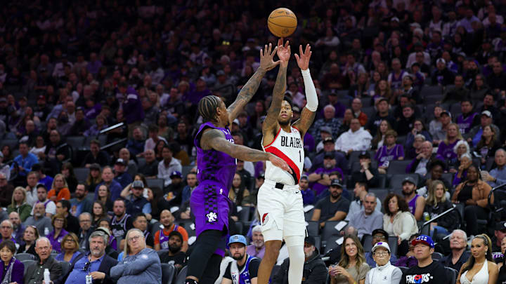 Oct 28, 2024; Sacramento, California, USA; Portland Trail Blazers guard Anfernee Simons (1) shoots the ball against Sacramento Kings forward DeMar DeRozan (10) during the first quarter at Golden 1 Center. Mandatory Credit: Sergio Estrada-Imagn Images