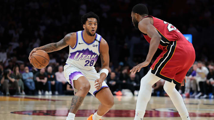 Feb 9, 2026; Miami, Florida, USA; Utah Jazz forward Brice Sensabaugh (28) dribbles the basketball against Miami Heat forward Andrew Wiggins (22) during the second quarter at Kaseya Center. Mandatory Credit: Sam Navarro-Imagn Images