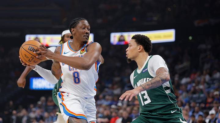 Oct 7, 2026; Oklahoma City, Oklahoma, USA; Oklahoma City Thunder guard Jalen Williams (8) drives against Milwaukee Bucks guard Ryan Rollins (13) during the first half of a preseason game at Paycom Center. Mandatory Credit: Alonzo Adams-Imagn Images