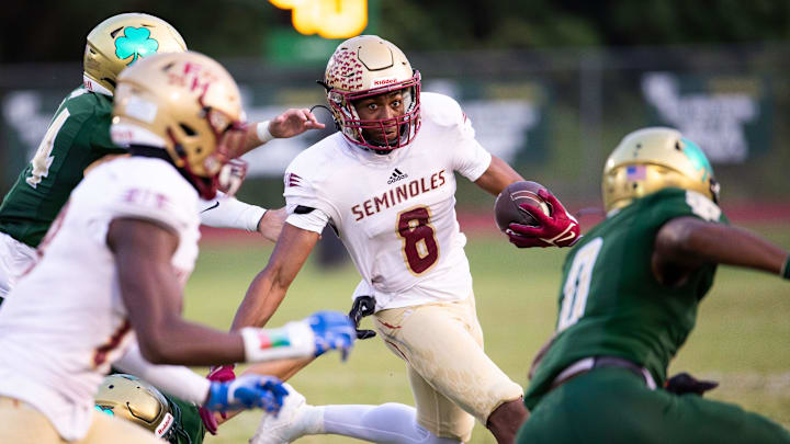 Florida State University High School Micahi Danzy (8) is pursued by the Trinity Catholic defense. The Trinity Catholic Celtics hosted the Florida State University High School at Trinity Catholic High School in Ocala, FL on Friday, September 29, 2023. [Doug Engle/Ocala Star Banner]