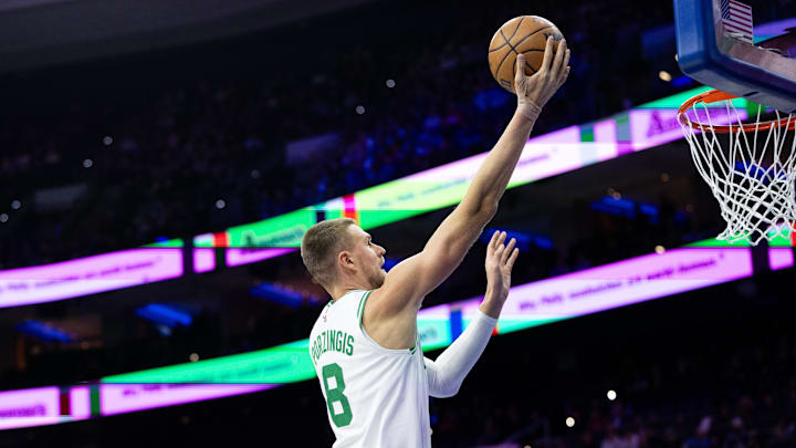 Feb 20, 2025; Philadelphia, Pennsylvania, USA; Boston Celtics center Kristaps Porzingis (8) scores against the Philadelphia 76ers during the first quarter at Wells Fargo Center. Mandatory Credit: Bill Streicher-Imagn Images