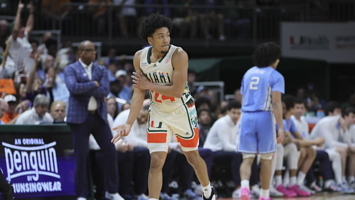Feb 10, 2024; Coral Gables, Florida, USA; Miami Hurricanes guard Nijel Pack (24) reacts after scoring against the North Carolina Tar Heels during the first half at Watsco Center. Mandatory Credit: Sam Navarro-Imagn Images