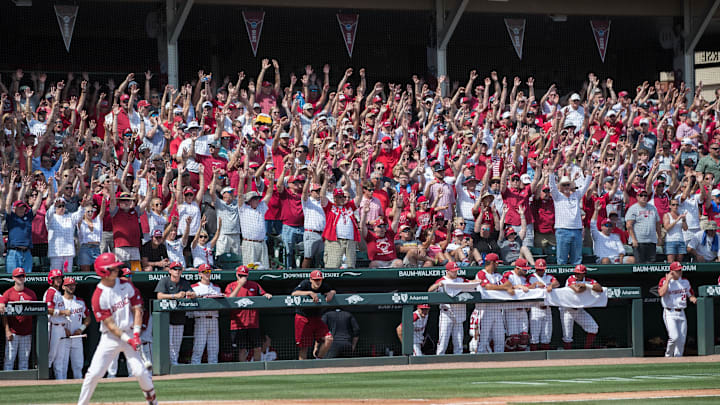 Jun 10, 2019; Fayetteville, AR, USA; Arkansas Razorbacks fans chant as Arkansas Razorbacks shortstop Casey Martin (15) is at bat during the game against the Mississippi Rebels at Baum-Walker Stadium. Mandatory Credit: Brett Rojo-Imagn Images