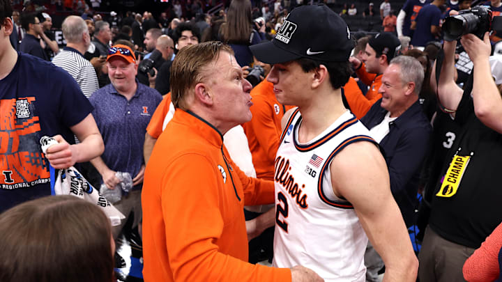 Mar 28, 2026; Houston, TX, USA; Illinois Fighting Illini head coach Brad Underwood and guard Andrej Stojakovic (2) celebrate after defeating the Iowa Hawkeyes in an Elite Eight game of the South Regional of the men's 2026 NCAA Tournament at Toyota Center.